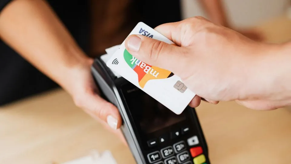 person paying by card