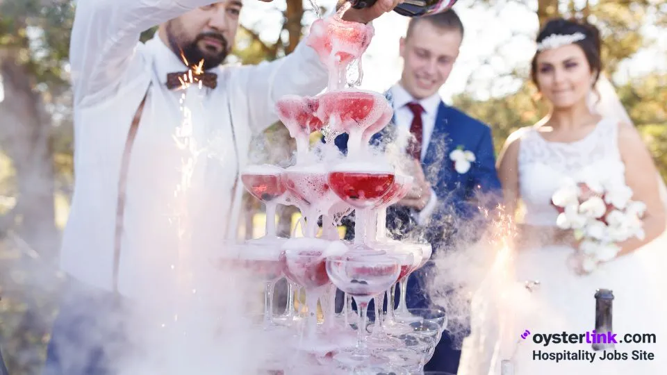 bartender pouring cocktails at a wedding 