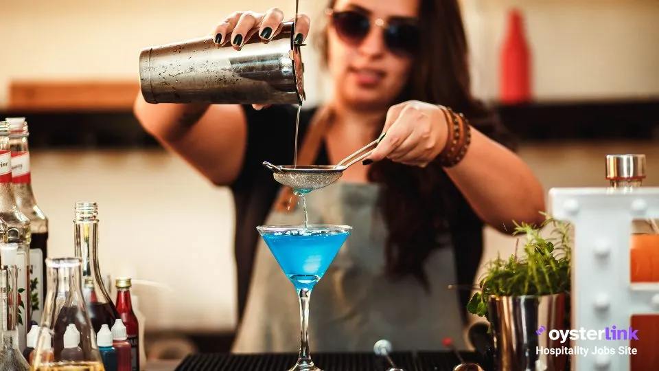 woman pouring a cocktail