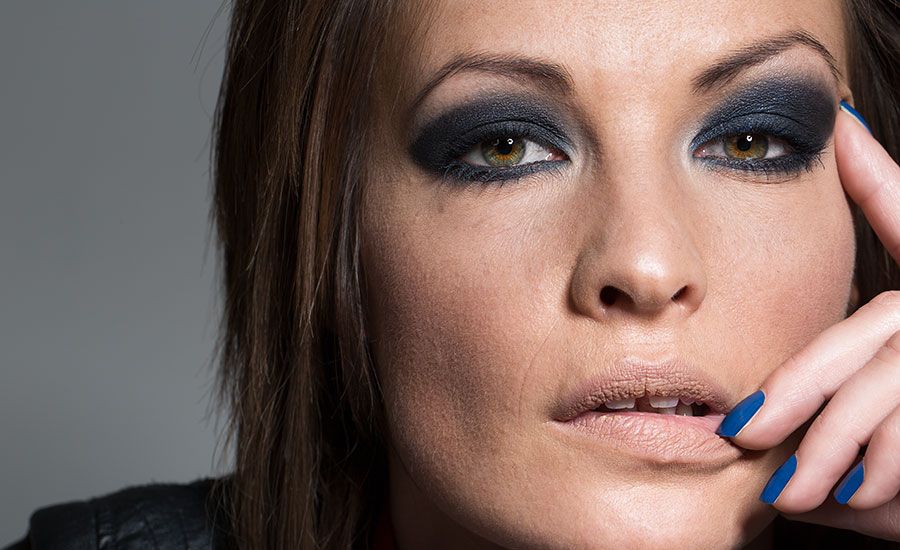 A woman wearing heacy makeup