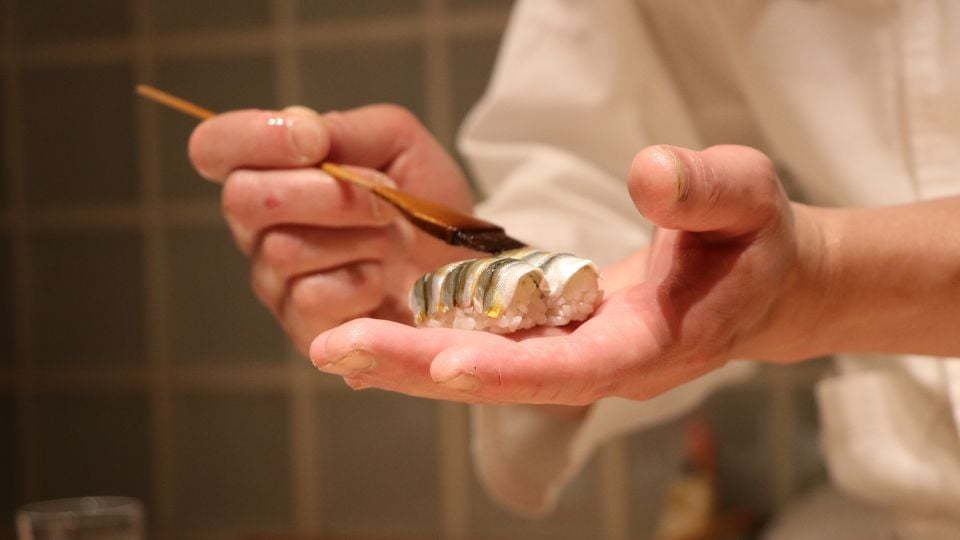 chef holding a sushi