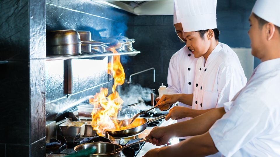 line cooks in a kitchen