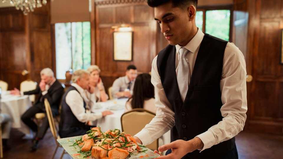waiter holding a tray
