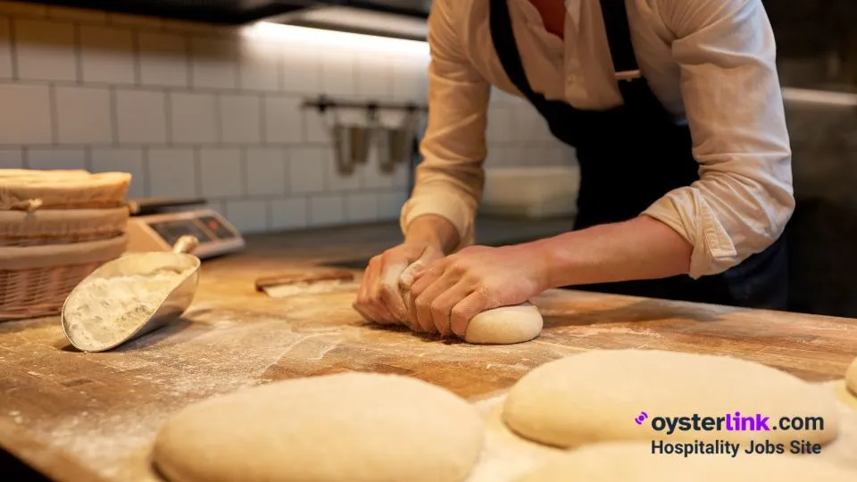 person kneading dough