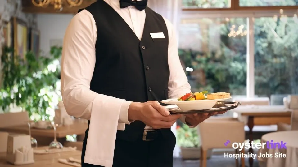 fine dining server holding a plate
