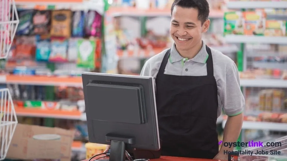 cashier looking at the cash register