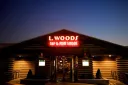L. Woods Tap & Pine Lodge logo