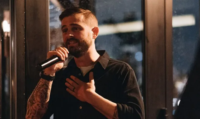 david kaplan speaking on microphone