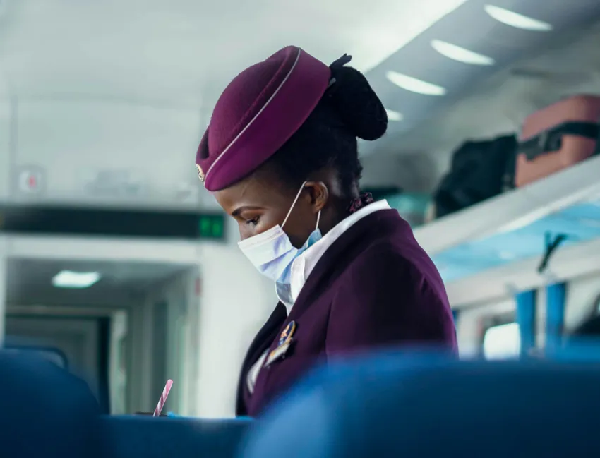 flight attendant serving flight guests