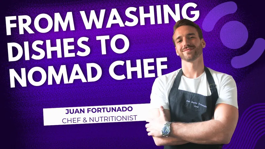 Chef Juan Fortunato wearing an apron, standing in a kitchen, and smiling