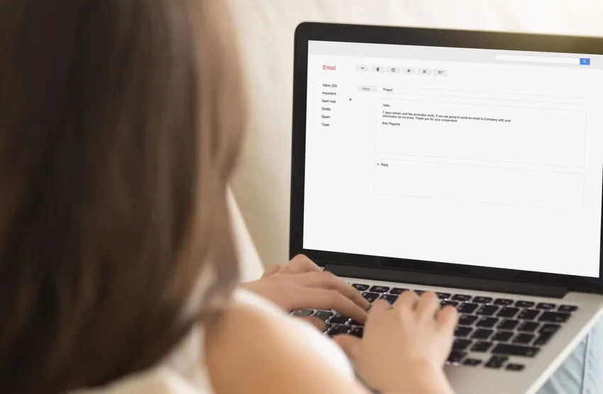 girls typing on a laptop