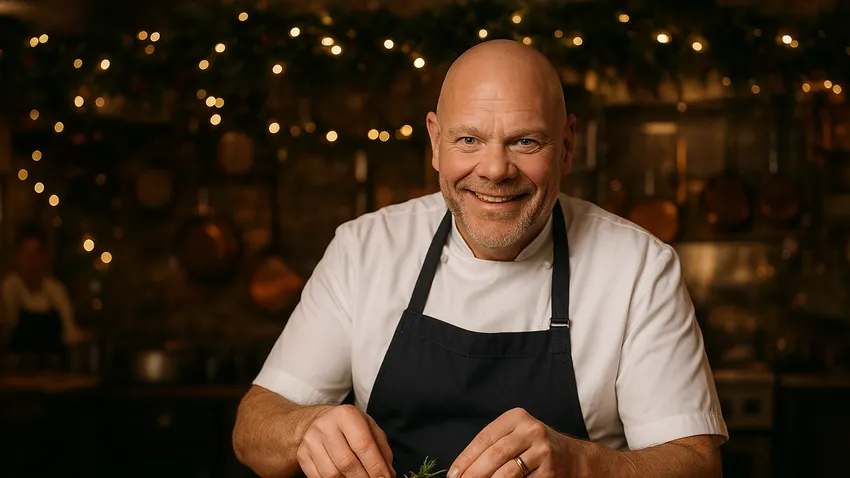 Tom Kerridge smiling in a professional kitchen with modern British dishes