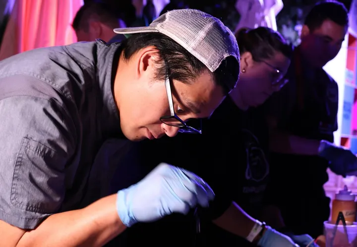 Chef Diego Ng cooking with others