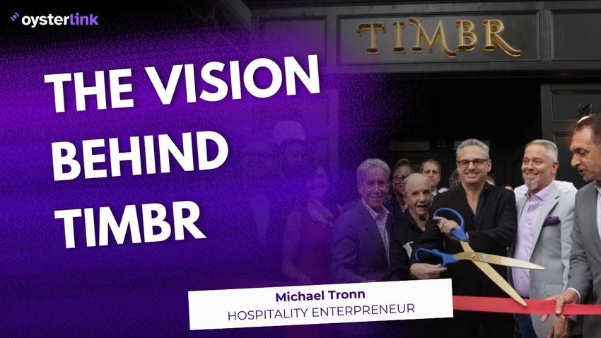 Michael Tronn wearing a black shirt and staring at the camera