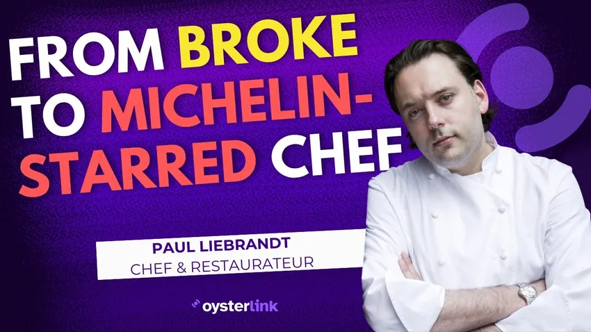 Chef Paul Liebrandt in a black & white photo holding a knife in the kitchen