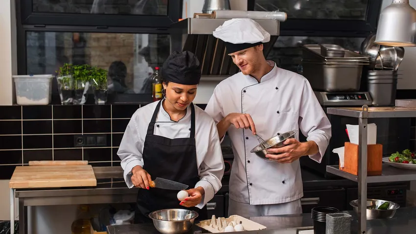 chef and sous chef in kitchen