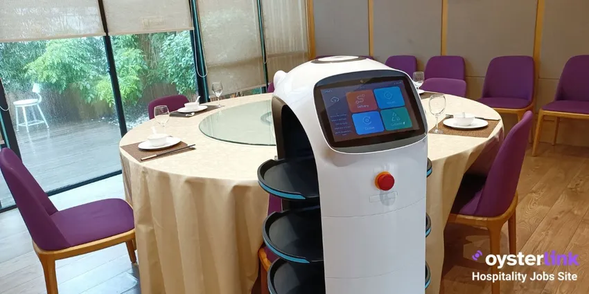 Robot server standing next to a restaurant table