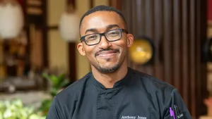 Chef Anthony Jones working at the kitchen cutting vegetables