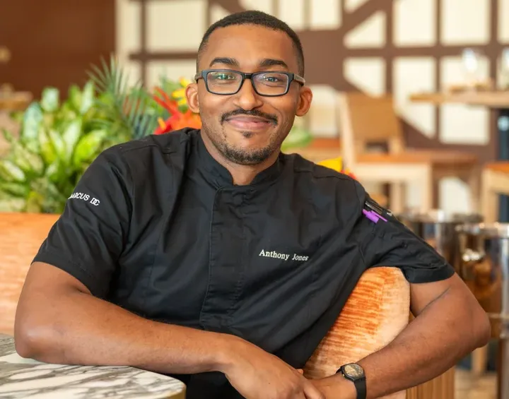 Chef Anthony Jones working at the kitchen cutting vegetables