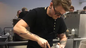 Black and White photo of Chef Daniel Lugovtsov sitting in the kitchen