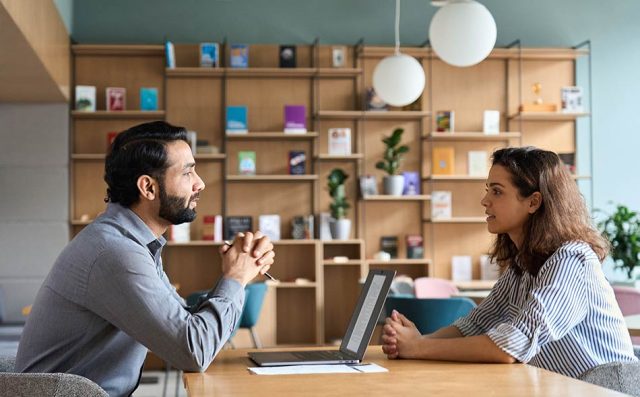 An image of a recruiter talking to a job candidate