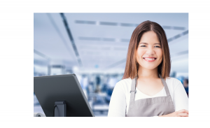 Cashier in front of a cash register