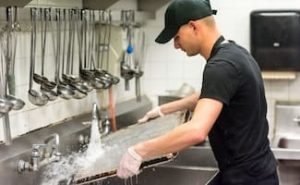 Dishwasher working at a restaurant kitchen