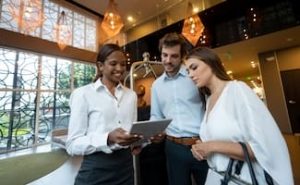 Hotel Manager talking with two clients