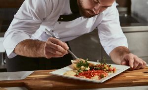 Chef assembling a dish