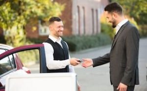 Valet returning keys to customer