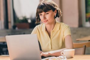 Photo of nice young brunette lady work laptop wear yellow t-shirt outside in park