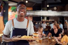 A smiling restaurant server