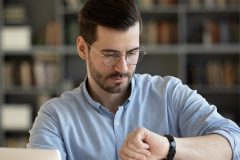 A man looking at his watch