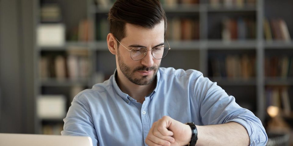 A man looking at his watch