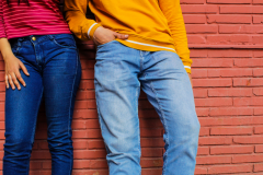 A man and a woman's legs in jeans