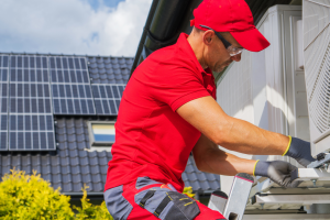 A man fixing air conditioner