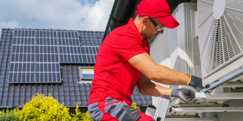 A man fixing air conditioner