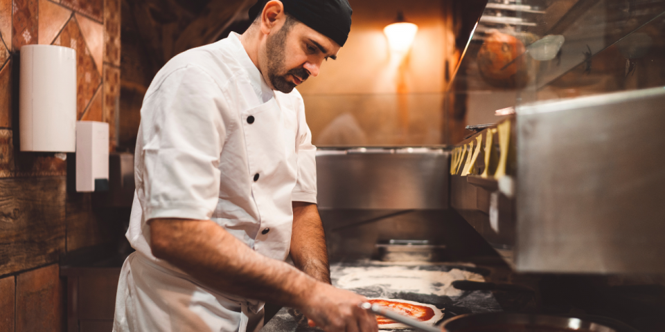 A man making a pizza