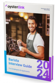 A barista about to pour coffee into a cup