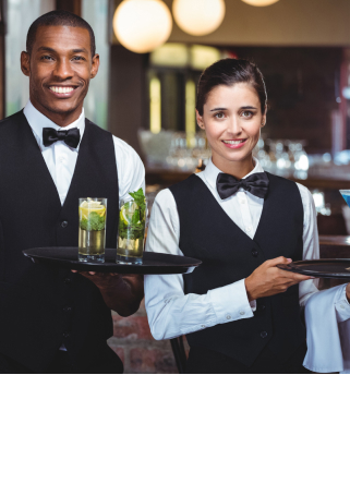 A waiter and a waitress in a restaurant