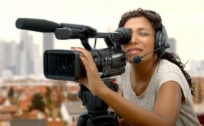 a woman operating a professional camera