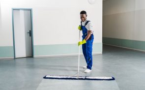 a custodian mopping the floor