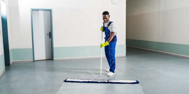 a custodian mopping the floor