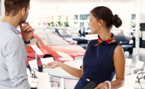 A woman sales representative engaged in conversation with a customer