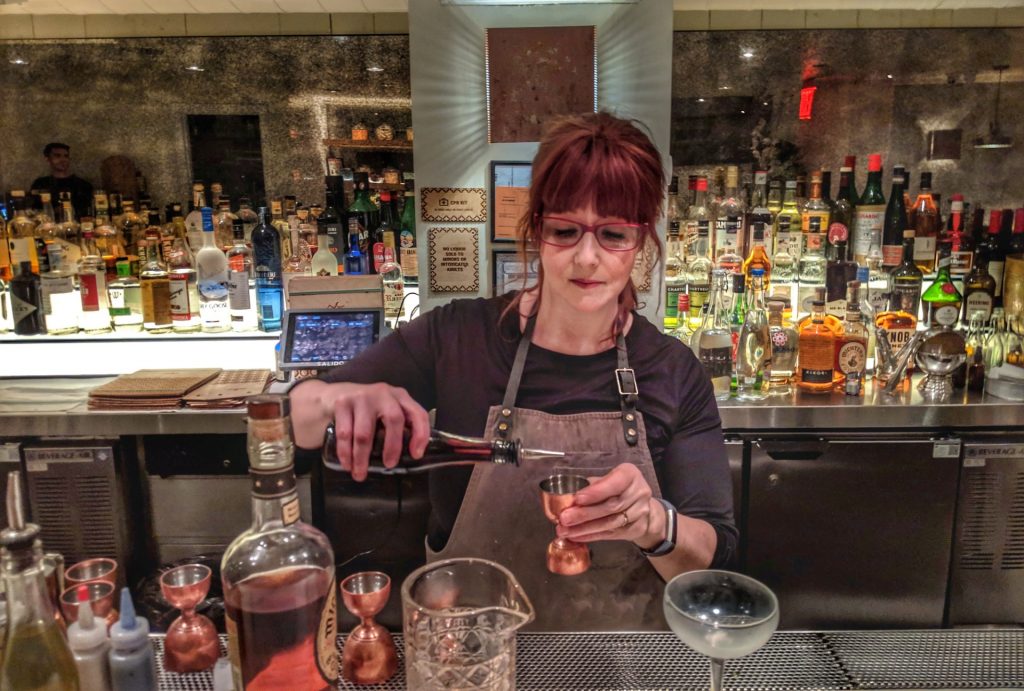 woman pouring a drink