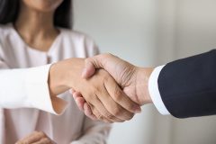 a man and woman shaking hands