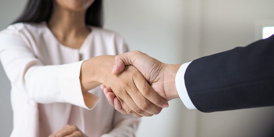 a man and woman shaking hands