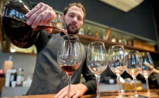 Sommelier pouring wine
