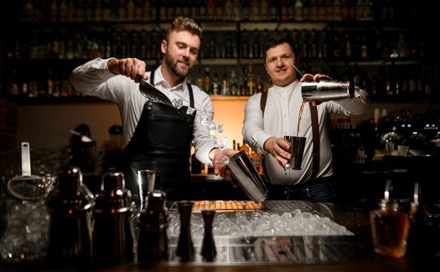 bartenders making cocktails
