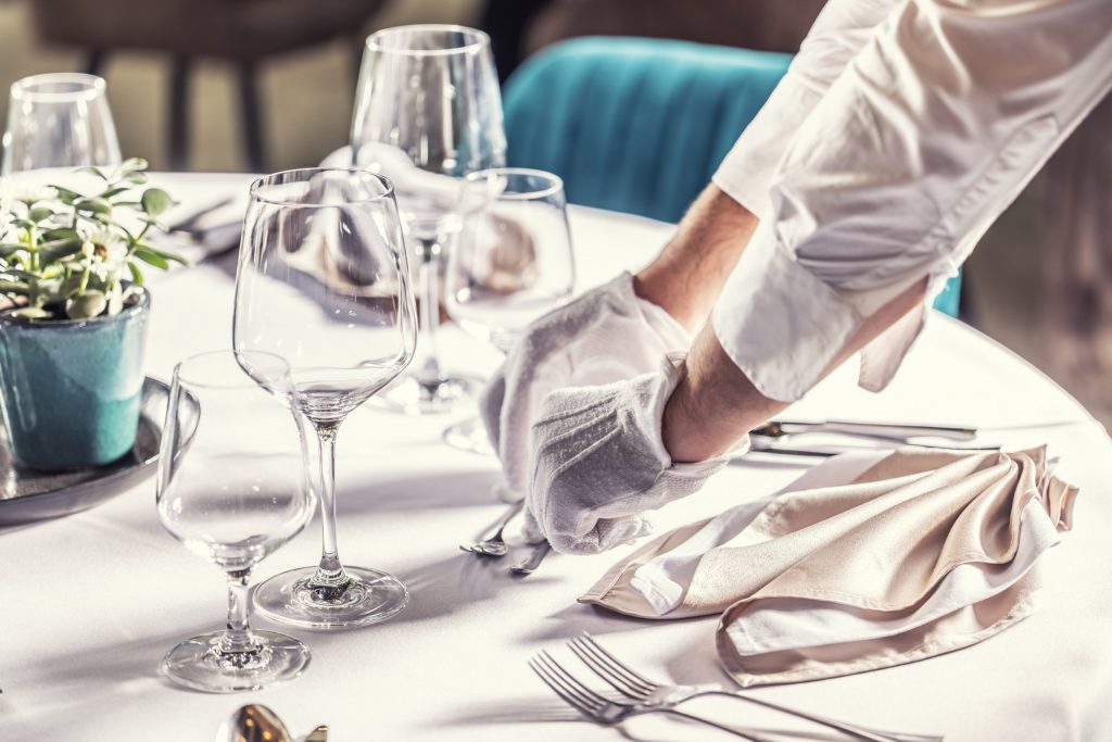 waiter setting up table